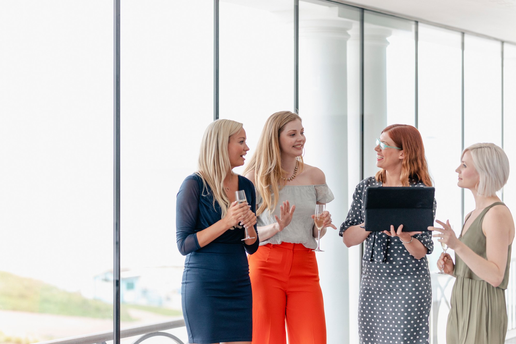 Business women at work social, using laptop